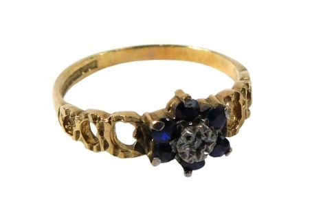 A 9ct gold cluster ring, the cluster set with six sapphires, centred by illusion set tiny diamond, maker T&S, Birmingham 1973, ring size P, 1.8g all in.