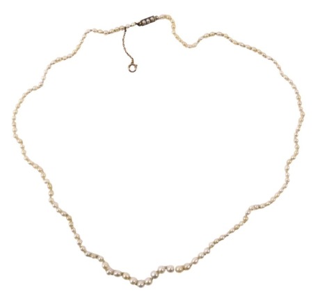 A cultured pearl necklace, of graduated form, with a rectangular clasp, set with three pearls, rose gold safety chain, yellow metal stamped 9ct, 46cm long, 6g.