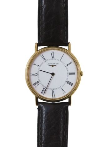 A Longines gentleman's wristwatch, in gold plated case, with white Roman numeric dial, on black strap, 3cm diameter, boxed.