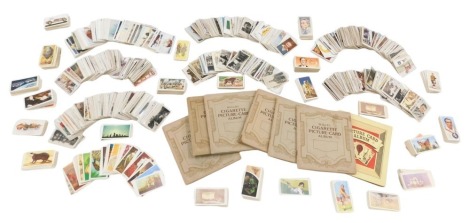 A quantity of cigarette, tea and trade cards, album sets and assorted players, churchmen, etc. (2 boxes)