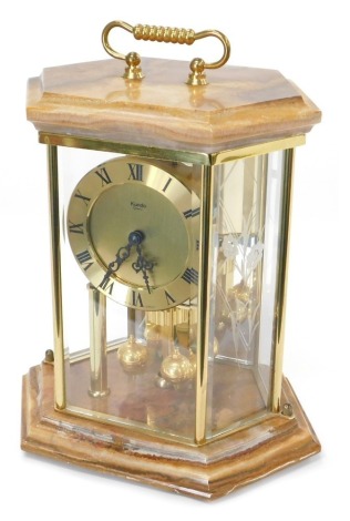 A Kundo quartz anniversary type clock, with onyx top and base, 24cm high.