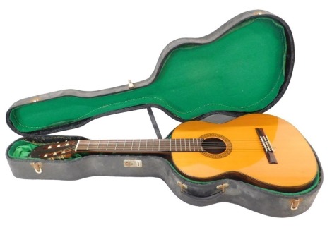 A Japanese Aria model number A556 acoustic guitar, in hard case, 102cm long.