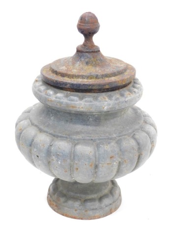 A cast iron urn and cover, of lobed form, 42cm high.