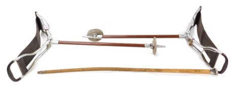 Two aluminium and brown painted metal shooting sticks, and a walking cane with silver knop. (3)