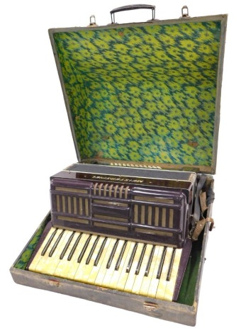 A Meisterspiel brown Bakelite piano accordion, in fitted case.