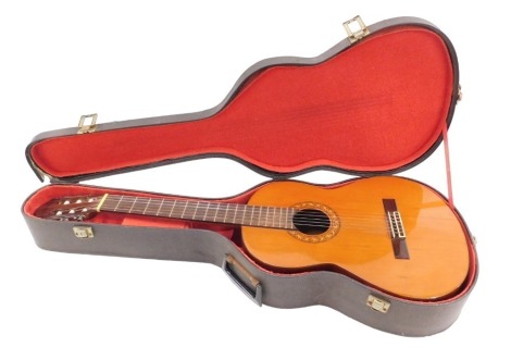 A Spanish acoustic guitar, bearing label for Alhambra, dated 1977, hard shell travel case, 101cm long.