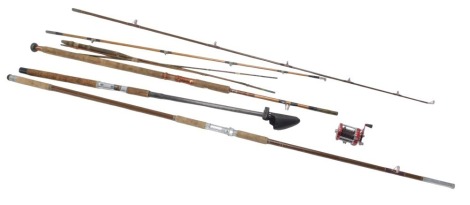 Two split cane fishing rods, a gold medal by Mounder and Co, and a fibre on and a spool. (a quantity)