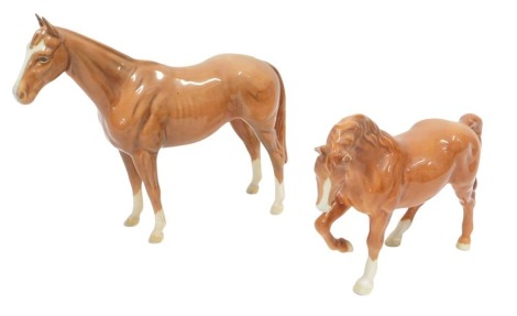 Two brown Beswick horses, 19cm and 15cm high. (2, AF)