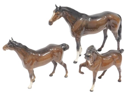 Three Beswick ceramic horses, 24cm, 23cm, and 20cm high. (3, AF)