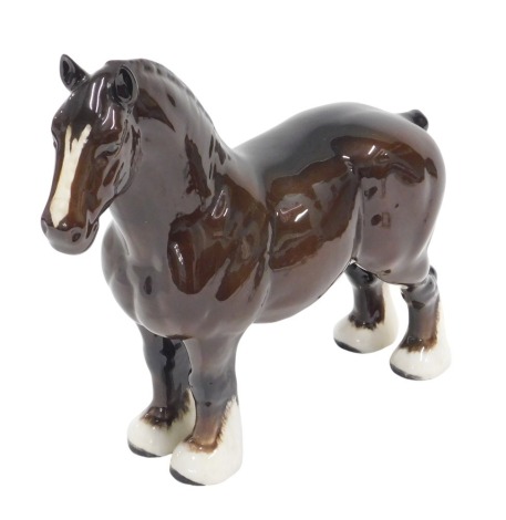 A Beswick brown glazed shire horse figure, 24cm high.