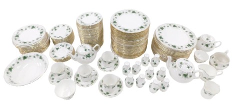 A Colclough and Duchess part dinner service, on an ivy and daisy ground, to include dinner plates, salt and pepper pots, side plates, three teapots, coffee cans and saucers, side plates, etc.