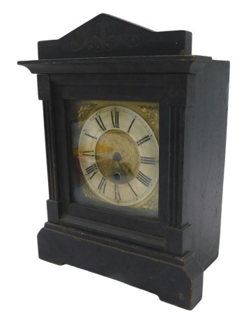 A late 19thC mantel clock, in black ebonised case, with brass dial with spandrels, the case with reeded columns, eight day movement, 32cm high, 26cm wide, 15cm deep.