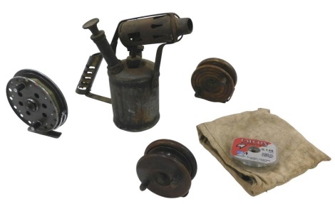 Three vintage fishing reels, comprising a Gypsy DOR reel, two wooden reels unmarked, and a blow lamp. (4)