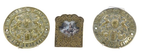 Two Milner's Patent High Resistant brass plaques, 22cm wide, and a floral photograph frame. (3)