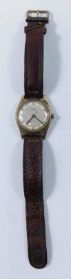 A Rone gent's wristwatch, with fifteen jewel non magnetic movement, on a silvered numeric dial, in yellow metal case, unmarked, on brown leather strap, 2.5cm diameter, 26.8g all in. - 2