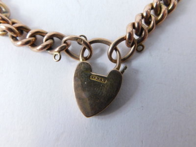 A curb link charm bracelet, with heart shaped padlock, the padlock only stamped 9ct, the chain 20cm long, 10.4g. - 3