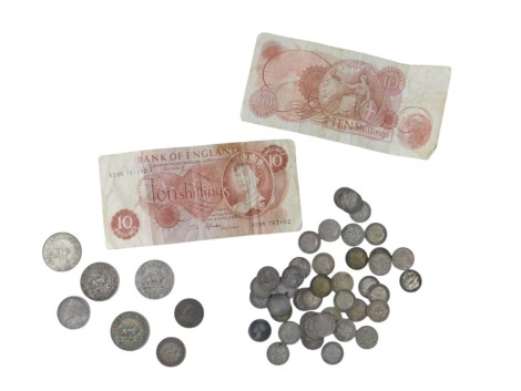 Two ten shilling notes, various threepence pieces, and various East African shillings.