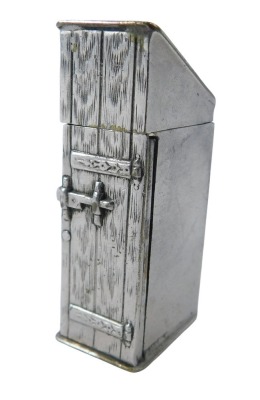 A silver plated novelty match case, formed as a stable door, with hinged lid, with strike base, 5cm high.