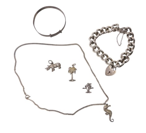 Silver and other jewellery, comprising silver curb link bracelet with heart shaped padlock, silver child's bangle, various charms, and a seahorse necklace and chain, 2.48oz. (a quantity)