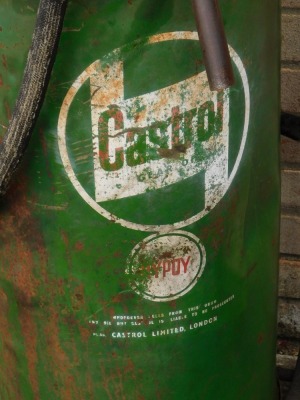 A Castrol oil drum on wheel support, painted in green, 87cm high. - 2