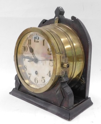 A brass WWII German Kreigsmarine u-boat or submarine clock, the silvered dial with Arabic numerals, engraved with the Third Reich eagle and 1073 N, later mount, the dial 17cm diameter. - 4