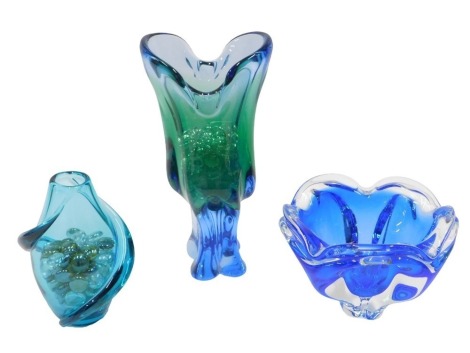 Three items of Art Glass, comprising a blue twist stem vase, 17cm high, a green and blue trumpet vase, 28cm high, and a blue and white finish centre bowl, 11cm high. (3)