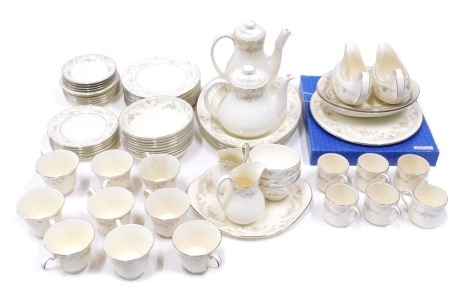 A Royal Doulton Diana pattern part tea and dinner service, comprising two gravy boats and saucers, two oval serving bowls, coffee pot, teapot, nine dessert bowls, eight medium plates, three sugar bowls, six coffee cans, nine teacups, two graduated jugs, t