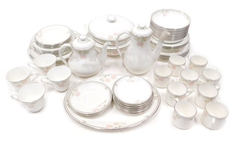 A Royal Doulton Twilight Rose pattern part tea and dinner service, comprising two tureens and covers, coffee pot, teapot, four dinner plates, ten dessert bowls, six medium plates, four cake plates, eight saucers, four teacups and nine coffee cans.