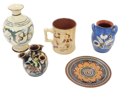 A quantity of Devon Mottoware of similar pieces, to include a Widdicombe Fair mug, etc. (5)