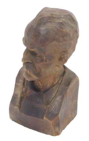 Tribal Art. A carved tribal figure of a gentleman with moustache, on green baize lined base.