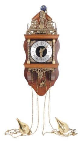 A Dutch Zaandam wall clock, mounted with a figure of Atlas, etc., with silvered dial, in mahogany case, 57cm high.