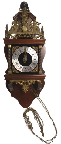 A Dutch Zaandam wall clock, mounted with a figure of Atlas, etc., with silvered dial, in mahogany case, 57cm high.