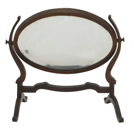 An Edwardian mahogany chequer banded oval dressing table mirror, with a bevelled mirror plate, on splayed legs, 43cm wide. (AF)