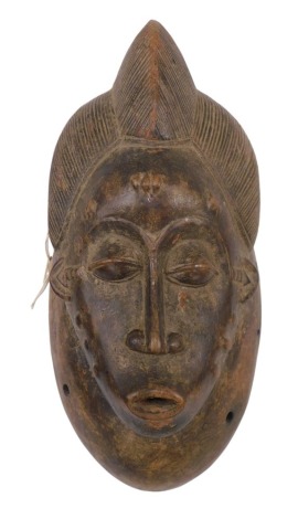 Tribal Art. Baule/Baoule, Mblo portrait mask on base, faded red kaolin pigment, Cote D'Ivoire, 39cm high.