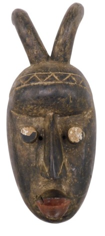 Tribal Art. Grebo/Kru/Krou, warrior face mask with pinhole eyes and antelope horns, Liberia, 38cm high.