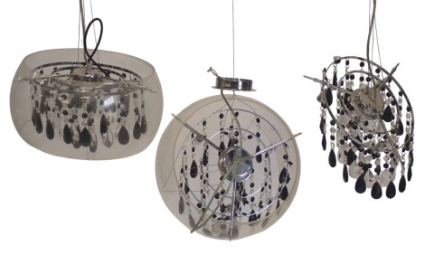 Two clear glass light fittings, with insert of clear and black coloured drops, 37cm wide, and a further set of drops but no shade.