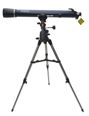 A Celestron Astramaster 90EQ telescope, with tripod, boxed.