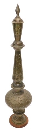 An Eastern engraved and pierced brass hookah pipe, with wooden foot, lacking any fittings, 135cm high. (AF)