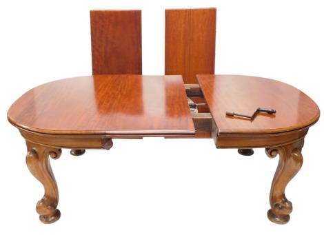 A Victorian and mahogany extending dining table, with three loose leaves, the top with a moulded edge and rounded ends, on cabriole legs, with pad feet, and castors, 73cm high, 291cm long, 129cm wide, one leaf associated.