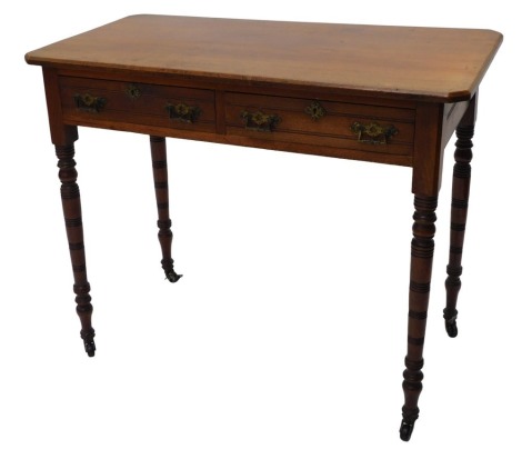 A late 19thC walnut side table, the rectangular top with chamfered corners above two frieze drawers with gilt brass aesthetic movement handles, on turned legs with castors, 91cm wide.