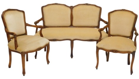 A stained beech three piece suite, in French style, comprising two seat sofa, with padded back and seat, on cabriole legs, and two matching armchairs, the sofa 123cm wide. The upholstery in this lot does not comply with the 1988 (Fire & Fire Furnishing) R