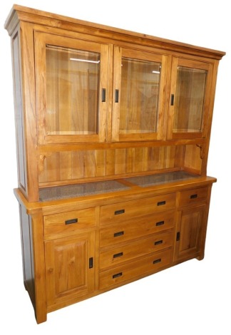 An oak dresser, the top with two glazed doors, the base with quartz or granite insert, above an arrangement of six drawers, and two panelled doors, on styles, 200cm high, 176cm wide.