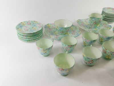 A Shelley Melody pattern part tea service, comprising two rectangular cake plates, milk jug, sugar bowl, twelve teacups, twelve saucers and twelve side plates. - 3