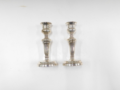 A pair of George V silver candlesticks, of tapered form, London 1935, on weighted bases, 13cm high. - 2