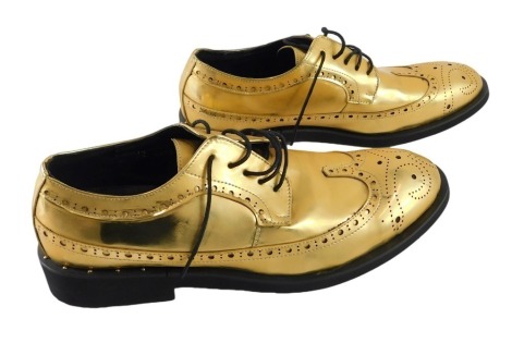 A pair of gold coloured gentleman's brogue shoes, size UK 10.