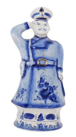 A Russian Ghel pottery decanter, modelled in the form of a captain or soldier, with removable cap, 31cm high.