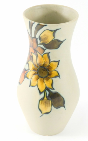 A Fiora Gouda Dutch ceramic vase, decorated with flowers on a cream ground, 27cm high.