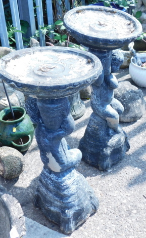 Two reconstituted stone black painted birdbaths, each in Oriental style.