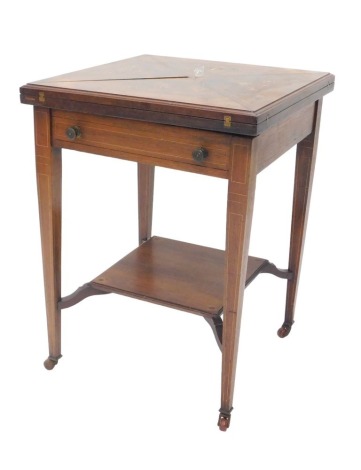 A Edwardian rosewood and marquetry envelope card table, with a frieze drawer, on square tapering legs, with an under tier, 54cm wide.