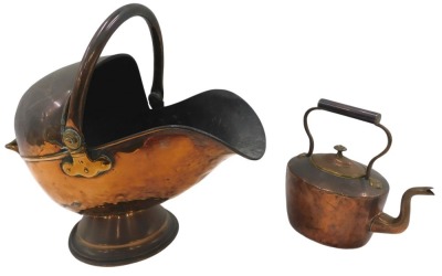 A late 19thC copper coal helmet, with hinged handle, and a kettle.